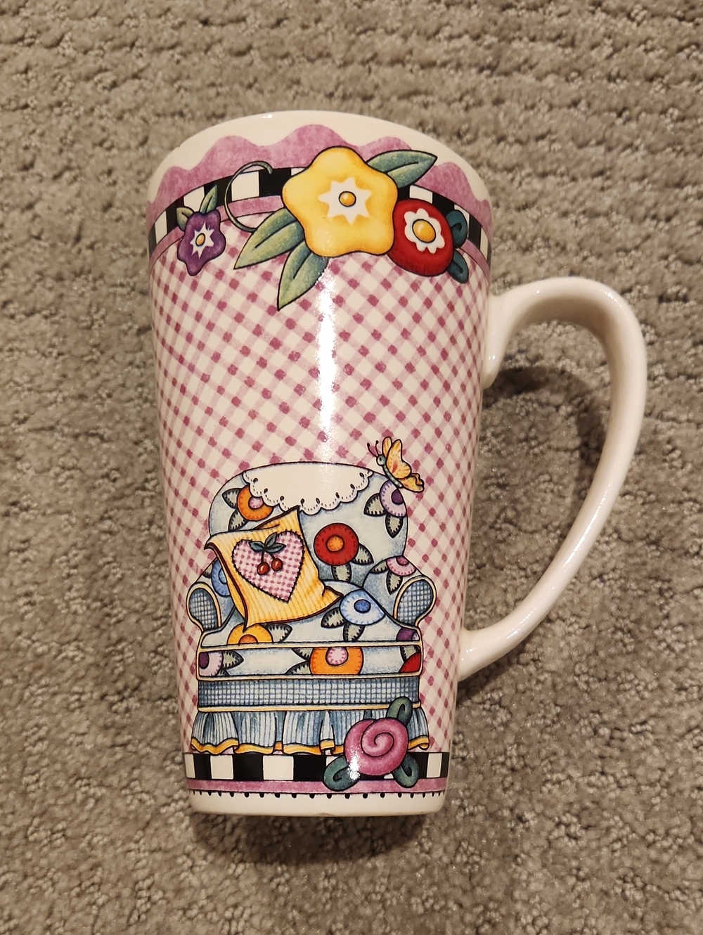Mary Engelbreit tall ceramic latte mug featuring a whimsical armchair